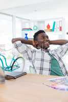 Male executive relaxing at his desk