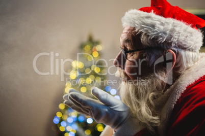 Santa Claus blowing kiss