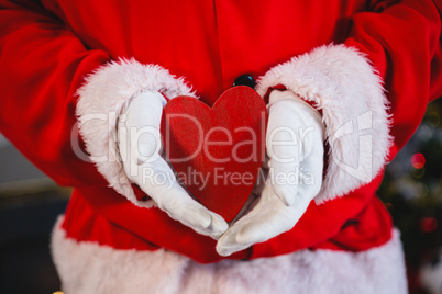 Santa claus holding a heart