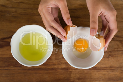 Woman holding a broken egg