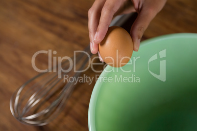 Woman holding a brown egg