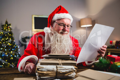 Santa Claus reading a letter