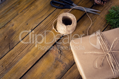 Fir and wrapping materials on wooden table
