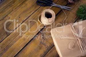 Fir and wrapping materials on wooden table