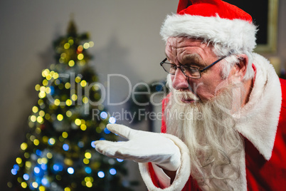 Santa Claus blowing kiss