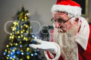 Santa Claus blowing kiss