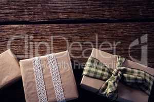 Various gift boxes on wooden plank