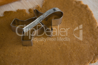 Cookie cutter placed over flattened dough