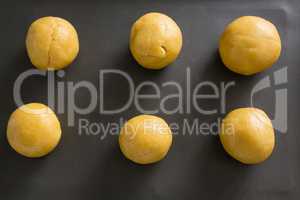 Dough balls on cooking tray