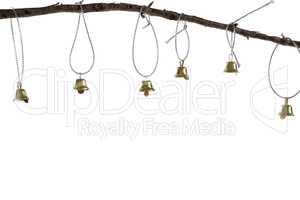Christmas bells hanging on branch