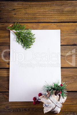 Christmas decoration with blank paper on wooden table