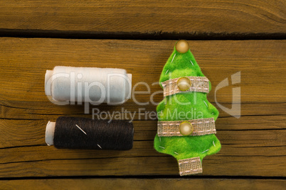 Overhead view of thread spools by Christmas decoration