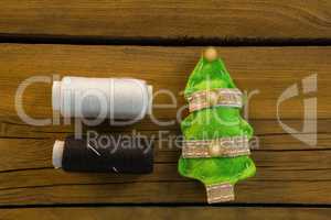 Overhead view of thread spools by Christmas decoration