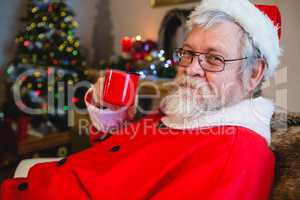 Santa Claus having coffee