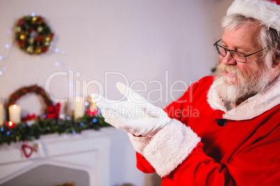 Santa standing with his hands cupped
