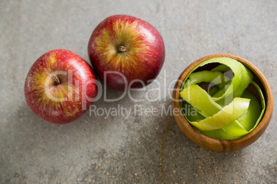 Peeled green apple and two red apple