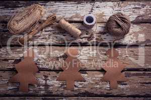 Crafts material and handmade christmas tree on wooden plank