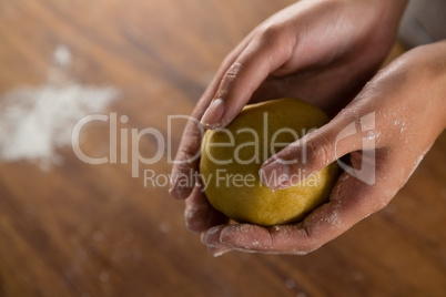 Woman holding a dough ball