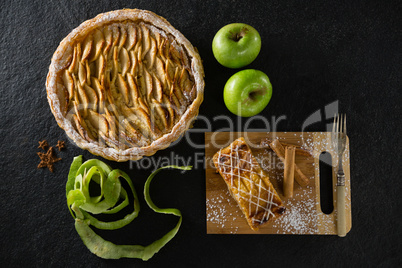 Tart and apple on concrete background