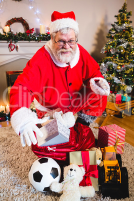 Portrait of santa with gift sack at home