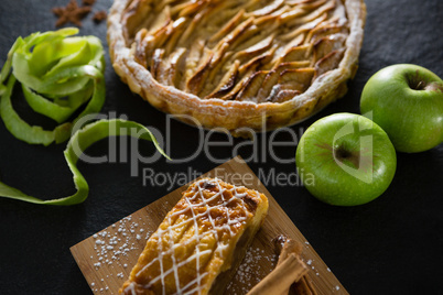 Tart and apple on concrete background