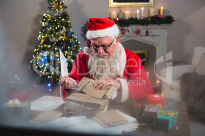 Santa Claus removing a letter
