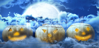 Composite image of jack o lanterns arranged on table