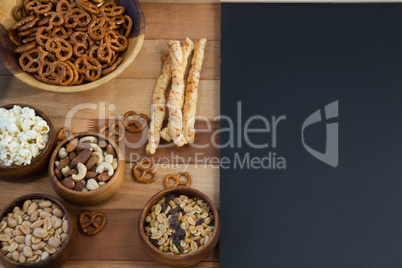 Various snacks on wooden table