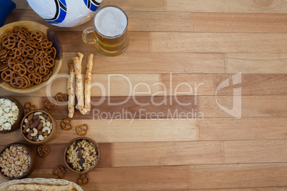 Fresh snacks and beer on wooden table