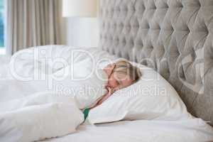 Girl sleeping on bed in bedroom