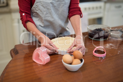 Woman preparing pan cake in kitchen
