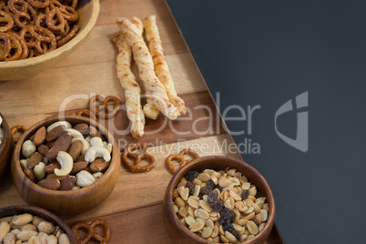 Various snacks on wooden table