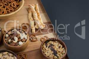 Various snacks on wooden table