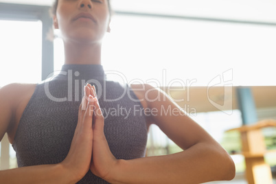 Woman performing yoga in the gym