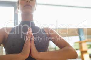 Woman performing yoga in the gym