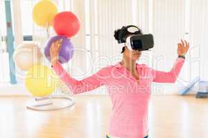 Woman performing while using virtual reality headset