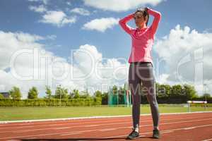 Woman standing on a race track
