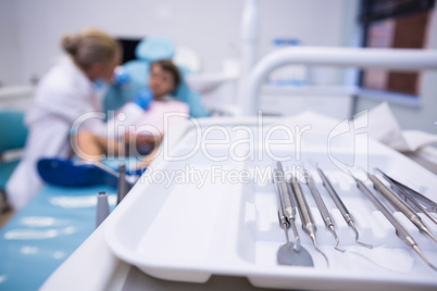 Close up of medical equipment on tray by dentist examining boy