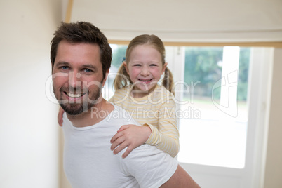 Young girl rides piggyback