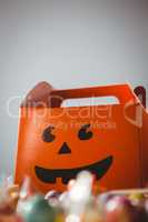 Low angle view of orange box with anthropomorphic smiley face