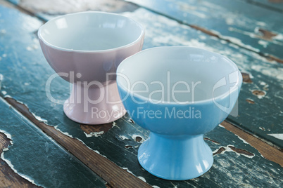 Two ceramic bowls on wooden table