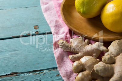 Close up of lemon and ginger on table
