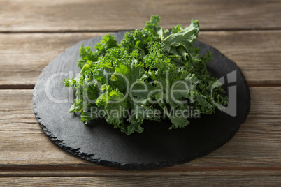 Fresh kale on plate over table