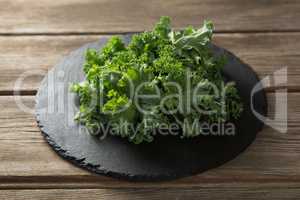 Fresh kale on plate over table