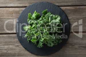 Overhead view of kale on plate over table