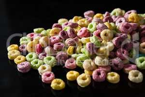 Froot loops on black background