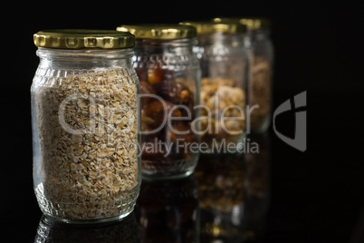 Dried fruits and breakfast cereals in glass jar