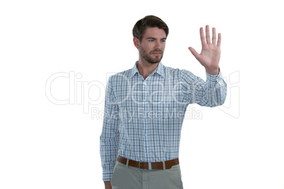 Man gesturing stop sign against white background