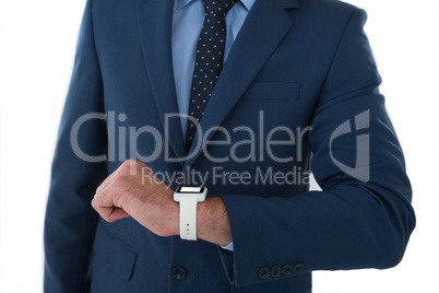 Mid section of businessman wearing smart watch