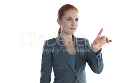 Attractive young businesswoman using imaginary interface